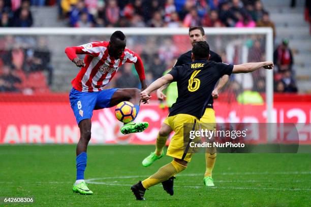 Lacina Traore forward of Sporting de Gijon controls the ball during the La Liga Santander match between Sporting de Gijon and Atletico de Madrid at...