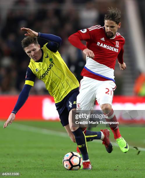 John Lundstram of Oxford United and Gaston Ramirez of Middlesbrough battle for possession during The Emirates FA Cup Fifth Round match between...