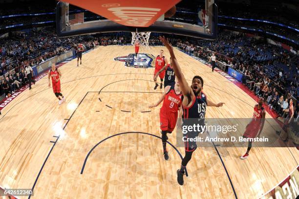 Karl-Anthony Towns of the USA Team drives to the basket against the World Team during the BBVA Compass Rising Stars Challenge as part of 2017...
