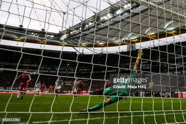 Pascal Gross of Ingolstadt scores penalty shot to make it 0-2 against Lukas Hradecky goal keeper of Frankfurt during the Bundesliga match between...