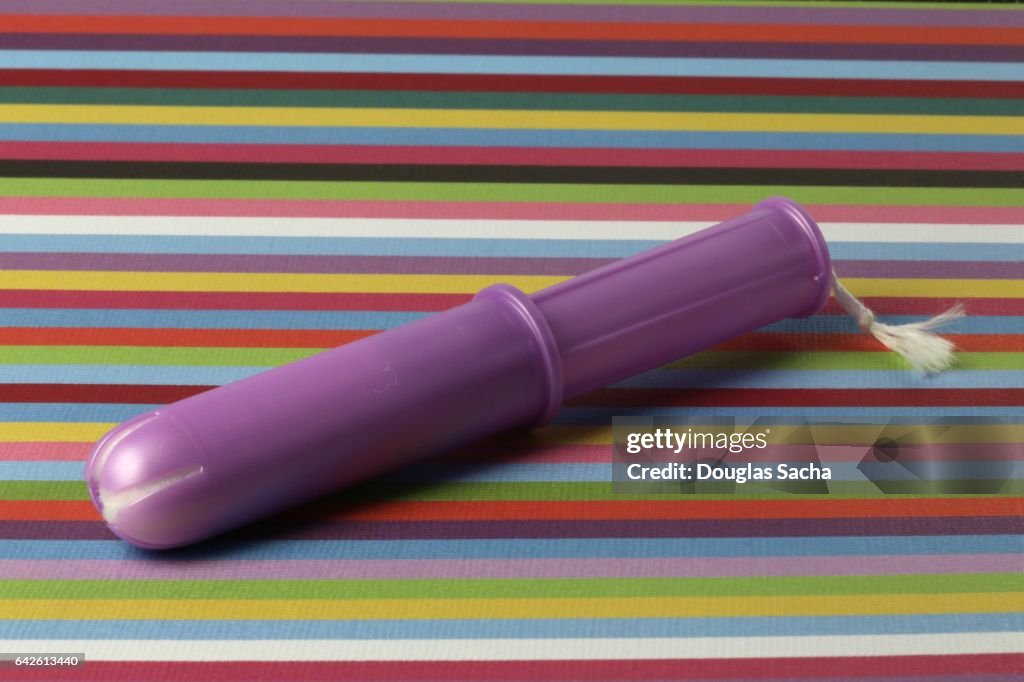 Tampon and plastic disposable applicator