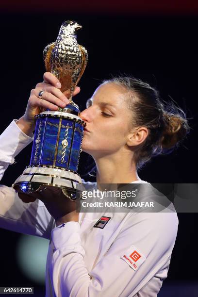 Karolina Pliskova of the Czech Republic poses for a picture with the winner's trophy after winning against Denmark's Caroline Wozniacki during their...