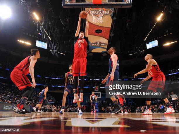 Kristaps Porzingis of the World Team grabs the rebound against the USA Team during the BBVA Compass Rising Stars Challenge as part of 2017 All-Star...
