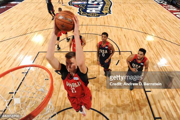 Kristaps Porzingis of the World Team dunks the ball against the USA Team during the BBVA Compass Rising Stars Challenge as part of 2017 All-Star...