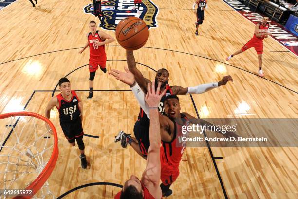 Jonathon Simmons of the USA Team drives to the basket against Buddy Hield of the World Team during the BBVA Compass Rising Stars Challenge as part of...