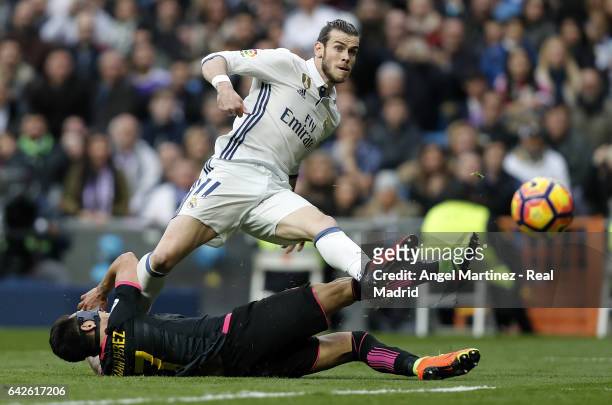 Gareth Bale of Real Madrid scores his team's second goal past Hernan Perez of RCD Espanyol during the La Liga match between Real Madrid and RCD...