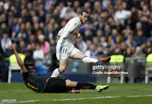 Gareth Bale of Real Madrid scores his team's second goal past Hernan Perez of RCD Espanyol during the La Liga match between Real Madrid and RCD...