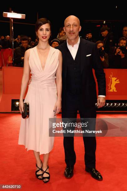 Actress Aylin Tezel wearing Boss and film director Oliver Hirschbiegel arrive for the closing ceremony of the 67th Berlinale International Film...