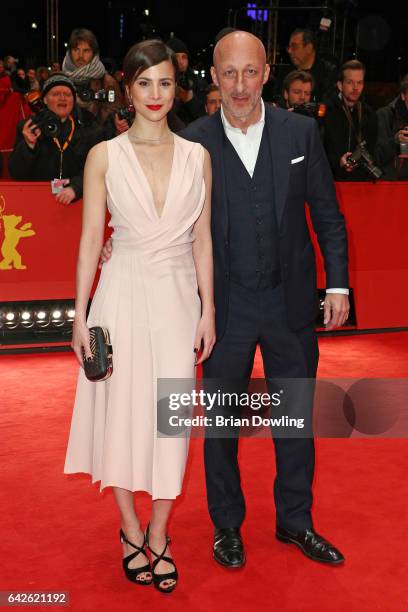 Actress Aylin Tezel wearing Boss and film director Oliver Hirschbiegel arrive for the closing ceremony of the 67th Berlinale International Film...