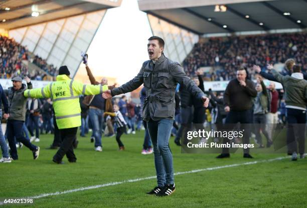 Millwall fans celebrate on the pitch after The Emirates FA Cup Fifth Round tie between Millwall and Leicester City at The Den on February 18, 2017 in...