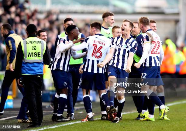 Tony Craig of Millwall celebrates with his team mates after The Emirates FA Cup Fifth Round match between Millwall and Leicester City at The Den on...