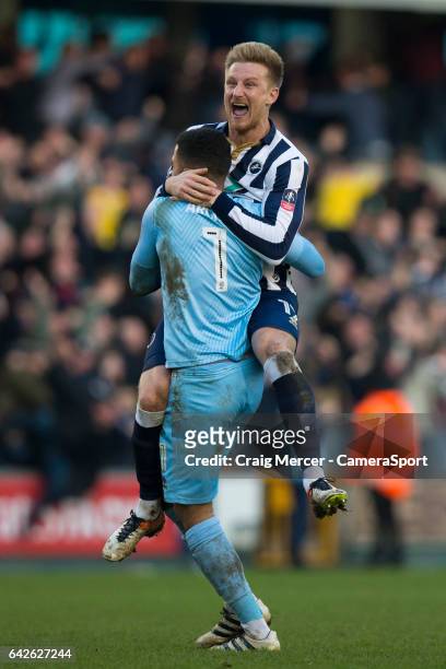 Millwall's Byron Webster and Jordan Archer celebrates their sides goal during the Emirates FA Cup Fifth Round match between Millwall v Leicester City...