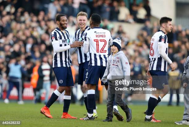 Shaun Cummings, Mahlon Romeo and Aiden O'Brian of Millwall celebrate after The Emirates FA Cup Fifth Round tie between Millwall and Leicester City at...