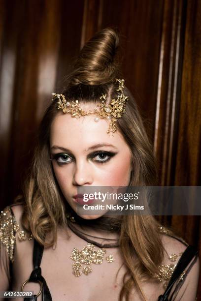 Model poses backstage ahead of the Limkokwing University show during the London Fashion Week February 2017 collections on February 17, 2017 in...