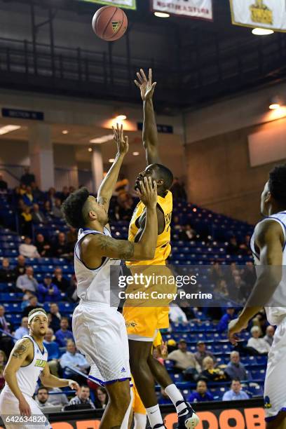 Rodney Williams of the Drexel Dragons can't get a hook shot to fall against Eric Carter of the Delaware Fightin Blue Hens during the first half at...