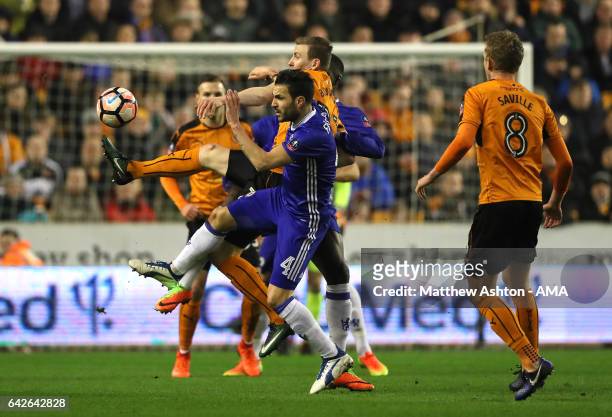 Jon Dadi Bodvarsson of Wolverhampton Wanderers competes with Cesc Fabregas of Chelsea during the Emirates FA Cup Fifth Round match between...