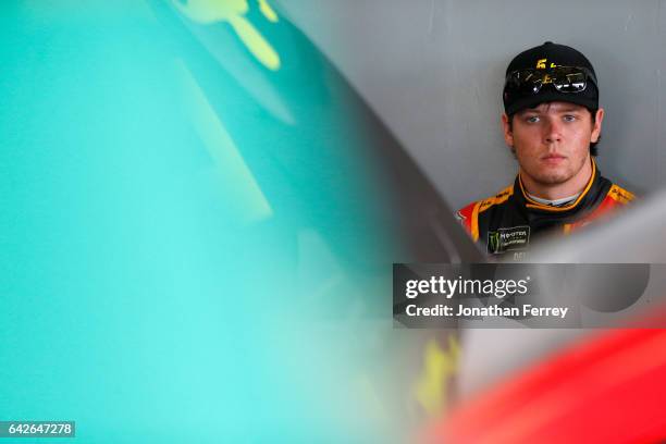 Erik Jones, driver of the 5-hour Energy Extra Strength Toyota, sits in the garage during practice for the Monster Energy NASCAR Cup Series 59th...
