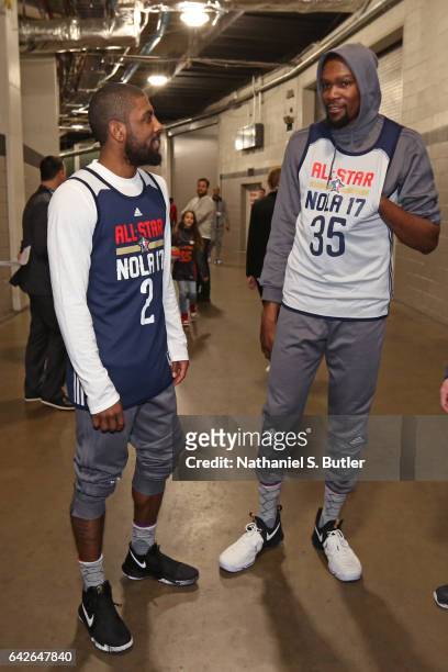 Kyrie Irving of the Eastern Conference All Star Team talks in the halls with Kevin Durant of the Western Conference All Star Team before NBA All-Star...
