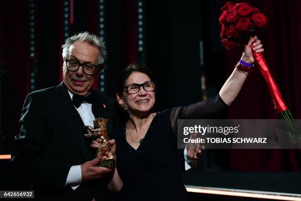 Hungarian director Ildiko Enyedi poses with the Golden Bear for Best Film "On Body and Soul" and Berlinale Director Dieter Kosslick at the awards...