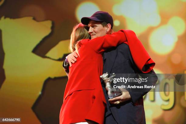 Actor Georg Friedrich speaks on stage as he receives Silver Bear for Best Actor Award for the movie 'Bright Nights' from Julia Jentsch during the...