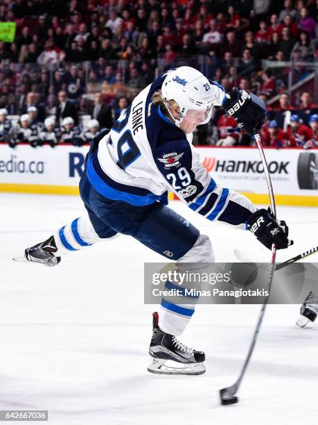 Patrik Laine of the Winnipeg Jets takes a shot during the NHL game against the Montreal Canadiens at the Bell Centre on February 18, 2017 in...