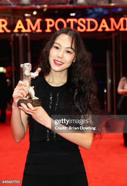 Actress Kim Min-hee poses the Silver Bear award for best actress after the closing ceremony of the 67th Berlinale International Film Festival Berlin...