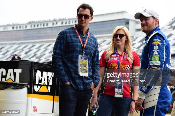Dale Earnhardt Jr., driver of the Nationwide Chevrolet, poses for a picture with IndyCar driver Graham Rahal and his wife, Courtney Force during...