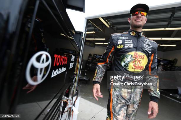 Martin Truex Jr., driver of the Bass Pro Shops/TRACKER BOATS Toyota, looks on during practice for the Monster Energy NASCAR Cup Series 59th Annual...