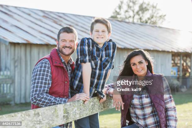family with teenage son on a farm - rural couple young stock pictures, royalty-free photos & images