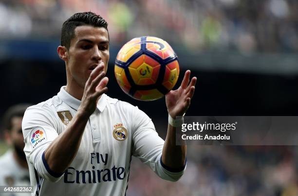Cristiano Ronaldo of Real Madrid checks the ball during the La Liga football match between Real Madrid and Espanyol at Santiago Bernabeu Stadium in...
