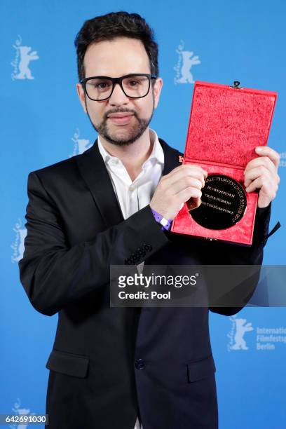 Director Diogo Costa Amarante winner of the Golden Bear for Best Short Film poses backstage after the closing ceremony of the 67th Berlinale...