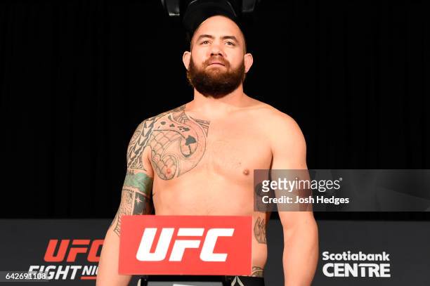 Travis Browne poses on the scale during the UFC Fight Night weigh-in at the World Trade Convention Centre on February 18, 2017 in Halifax, Nova...