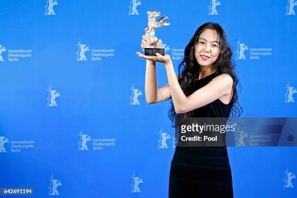 Actress Kim Min-hee poses with her Silver Bear for Best Actress backstage after the closing ceremony of the 67th Berlinale International Film...