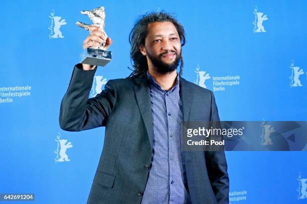 Alain Gomis holding the Silver Bear Grand Jury Prize for Felicite backstage after the closing ceremony of the 67th Berlinale International Film...