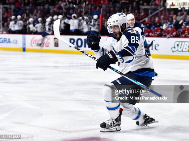 Mathieu Perreault of the Winnipeg Jets celebrates his third period goal during the NHL game against the Montreal Canadiens at the Bell Centre on...