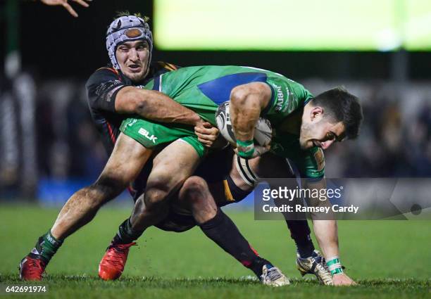 Galway , Ireland - 18 February 2017; Tiernan O'Halloran of Connacht is tackled by Ollie Griffiths of Newport Gwent Dragons during the Guinness PRO12...