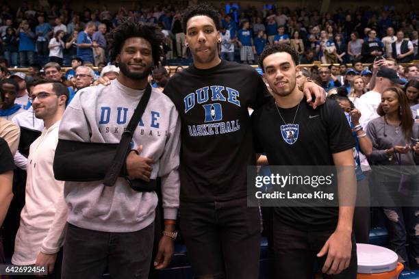 Former Duke basketball players Justise Winslow, Jahlil Okafor and Tyus Jones pose for a photo following the game between the Duke Blue Devils and the...