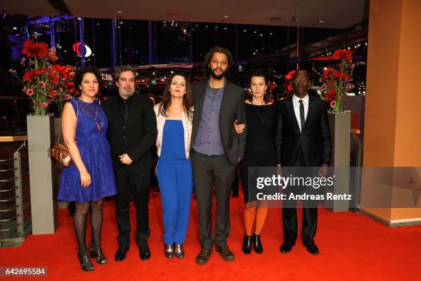 Film producer Arnaud Dommerc, a guest, film director Alain Gomis, screenwriter Delphine Zingg and producer Oumar Sall arrive for the closing ceremony...