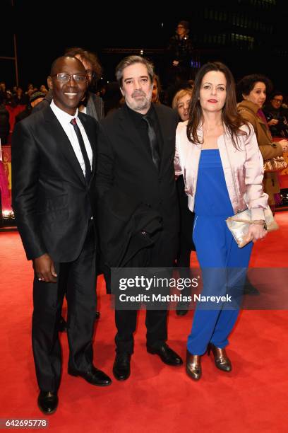 Producers Oumar Sall,Arnaud Dommerc and a guest arrive at the closing ceremony of the 67th Berlinale International Film Festival Berlin at Berlinale...