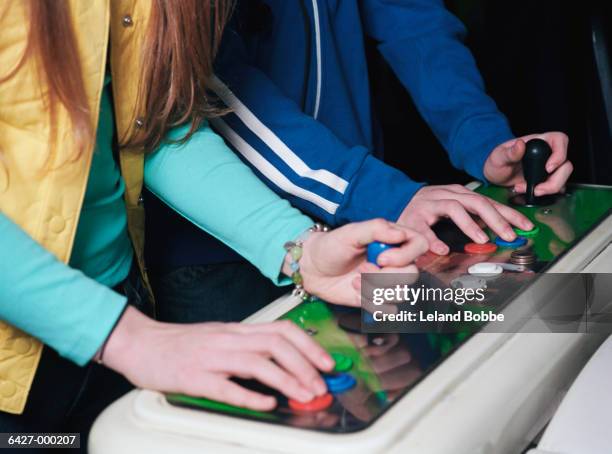 people playing video game - hands in her pants fotografías e imágenes de stock