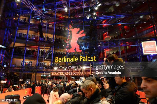 People wait for entry for the award ceremony during the 67th Berlinale International Film Festival Berlin at Berlinale palast in Berlin, Germany on...