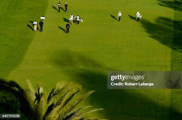 The group of John Huh, Cameron Smith of Australia and Thomas Pieters of Belgium make their way down the first fairway during the third round at the...