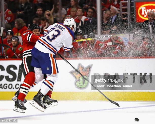 Matt Benning of the Edmonton Oilers collides with Tanner Kero of the Chicago Blackhawks at the United Center on February 18, 2017 in Chicago,...