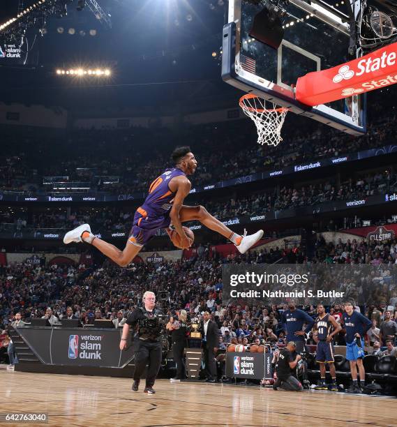 Derrick Jones Jr. #10 of the Phoenix Suns dunks during the Verizon Slam Dunk Contest during State Farm All-Star Saturday Night as part of the 2017...