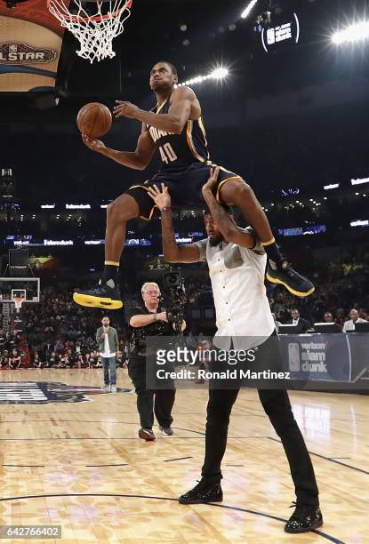 Glenn Robinson III of the Indiana Pacers competes in the 2017 Verizon Slam Dunk Contest with Paul George of the Indiana Pacers at Smoothie King...