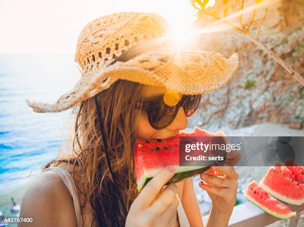 eating and enjoying watermelon - antalya province stock pictures, royalty-free photos & images
