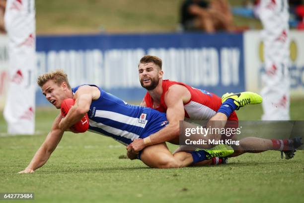 Mason Wood of the Kangaroos is tackled by Harry Marsh of the Swans during the 2017 JLT Community Series match between the Sydney Swans and North...