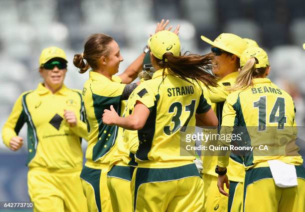 Ashleigh Gardner of Australia is congratulated by team mates after getting the wicket of Amy Satterthwaite of New Zealand during the second Women's...