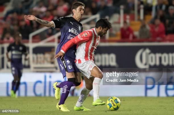 Nicolas Maturana of Necaxa covers the ball from Juan Forlin of Queretaro during the 7th round match between Necaxa and Queretaro as part of the...