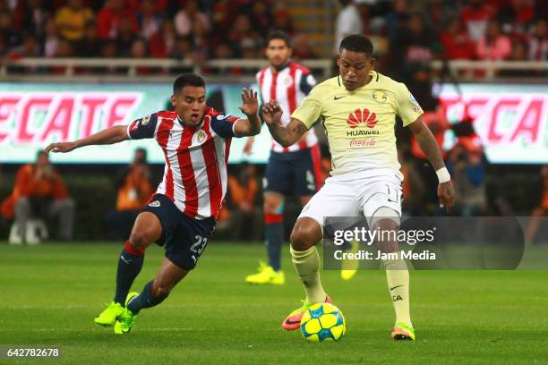 Jose Juan Vazquez of Chivas fights for the ball with Michael Arroyo of America during the 7th round match between Chivas and America as part of the...